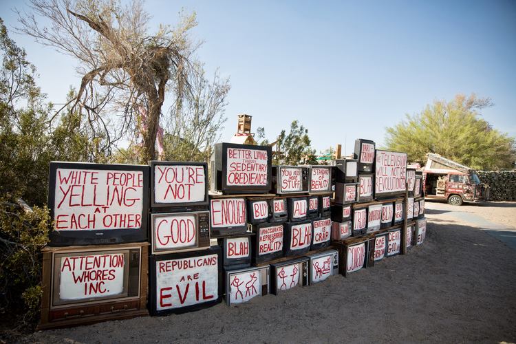 Photo of the TV wall at East Jesus, photo attributable to East Jesus
